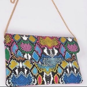 Gold chain snake clutch